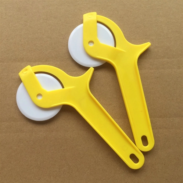Yellow color option for Plastic Thumb Press Pizza Cutter Or Knife